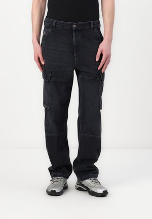 Black cargo pants featuring multiple pockets, a relaxed fit, and a textured denim fabric. Worn with silver athletic shoes.