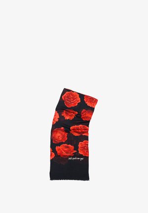 Écharpe noire avec des motifs de roses rouges ; tissu léger ; bords à franges ; présente le texte "kate spade new york" en blanc en bas.