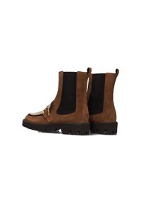 Brown suede ankle boots with black elastic panels, featuring a metallic accent and chunky rubber soles, streamlined design, and contrast stitching.