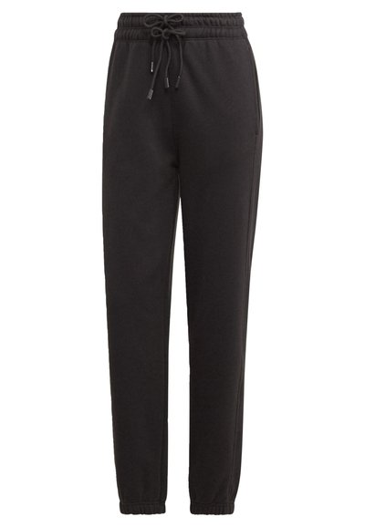 Schwarze Jogginghosen aus weichem, strukturiertem Stoff. Mit einem elastischen Bund und Kordelzug sowie schmal zulaufenden Bündchen an den Knöcheln.