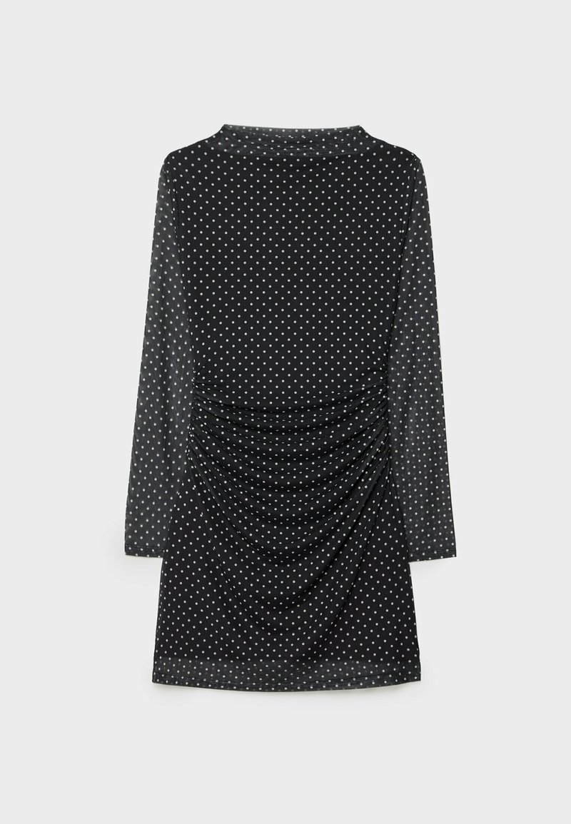 Schwarzes langärmliges Kleid mit weißen Polka-Dots, drapiertem Rücken und glattem Material. Einfacher Kragen und entspannter Schnitt.