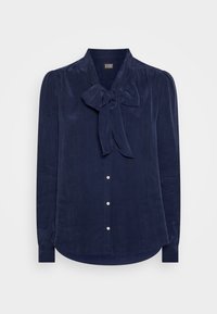 Granatowa bluzka z kokardą przy kołnierzyku, długimi rękawami, guzikiem z przodu, miękką teksturą i zaokrąglonym dołem.