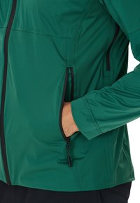 Endurance KOMINT - Veste de running - groen