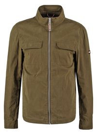 Olive green jacket with a high collar, front zip closure, two chest pockets, and subtle striped detailing on the neck. Made from smooth fabric.