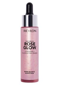 Base de teint Revlon Photoready Rose Glow dans un flacon transparent avec un liquide rose et un éclat doré, équipée d'un compte-gouttes et d'un capuchon argenté.