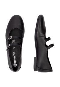 Schwarze Lederstiefel mit runder Zehenpartie, ausgestattet mit zwei verstellbaren Riemen und silberner Hardware. Glatte Textur und niedriger, stabiler Absatz.