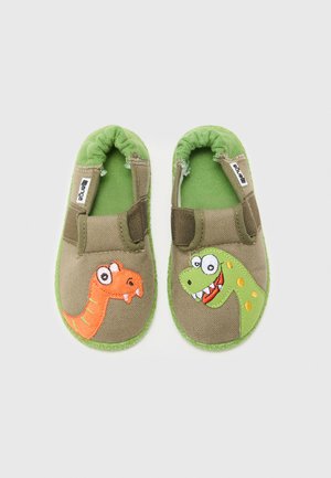 Toddler-sized green and brown fabric slippers with elastic backs, featuring smiling dinosaur faces—one orange, one green—on the toes.