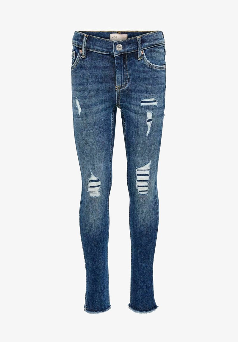 Jeans slim fit para niños en color azul con parches desgastados que revelan una tela a rayas blanca y azul marino en el interior, cierre de botón y dobladillos deshilachados.