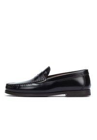 Black leather men's loafer with moc toe stitching and low heel, shown in side profile on white background.