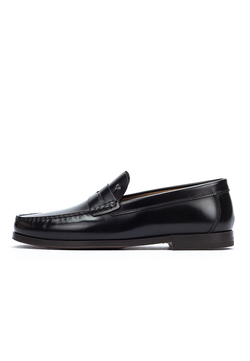 Black leather men's loafer with moc toe stitching and low heel, shown in side profile on white background.