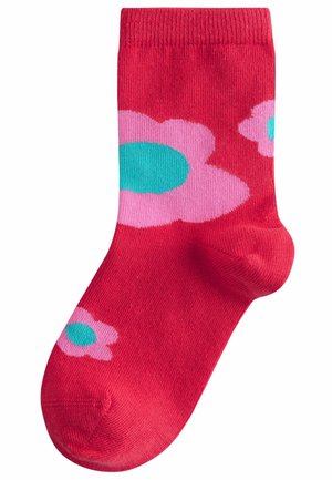 Calzino rosso realizzato in materiale elastico con forme di fiori rosa e centri turchesi. Altezza standard alla caviglia con polsino a costine. Texture liscia.