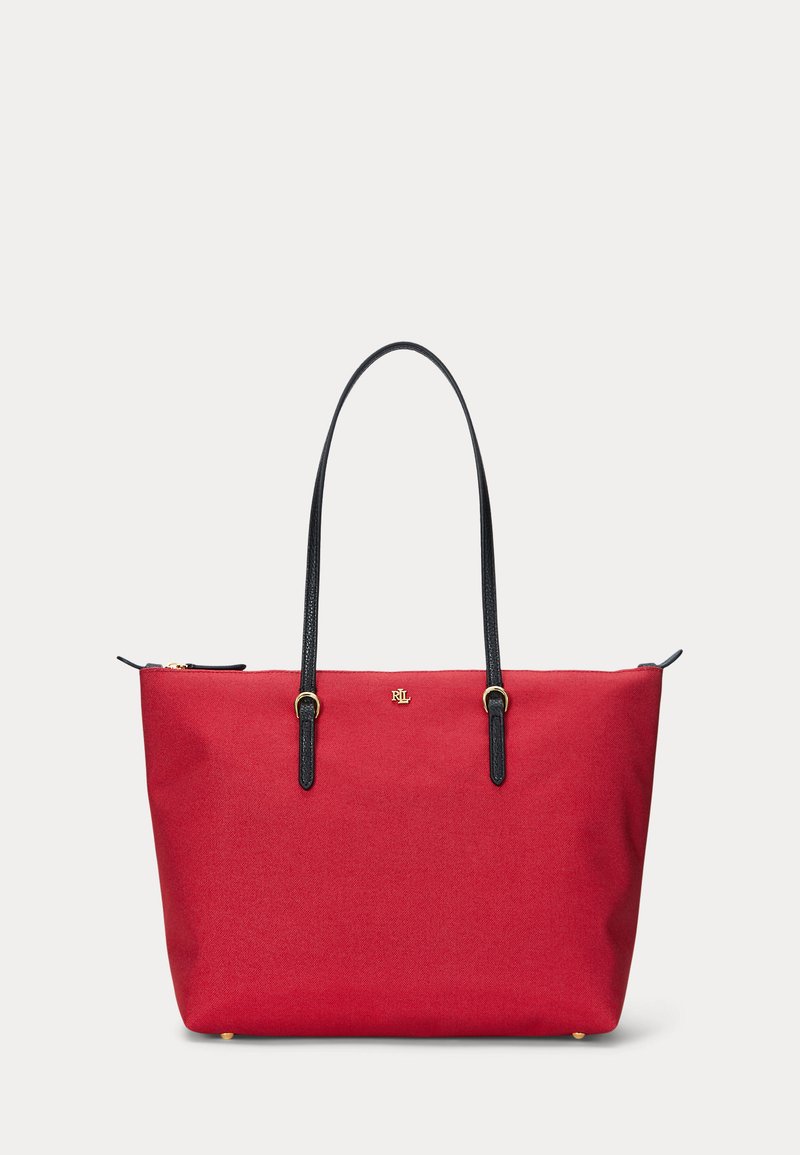 Red tote bag with black leather handles and small gold logo centered near the top, set against a plain white background.