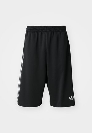 Schwarze sportliche Shorts aus weichem Stoff, mit einem elastischen Bund, seitlichen Taschen und weißen drei Streifen als Detail an den Seiten.