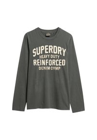 Langsleeve t-shirt van donkergrijze katoen, met bold crèmekleurige tekst: "SUPERDRY HEAVY DUTY REINFORCED DENIM COMP" over de voorkant.