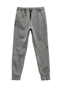 Grå sweatpants med en blød tekstur, elastisk talje, snor og samlede manchetter. Har sidelommer for ekstra funktionalitet.