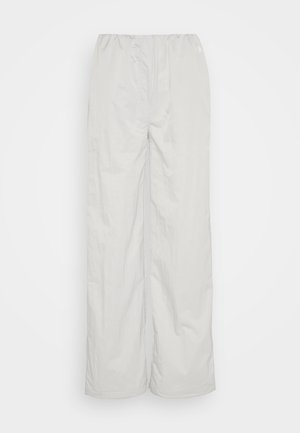 Light gray pants featuring an elastic waistband, wide-leg design, and smooth texture. No visible patterns or hardware details.