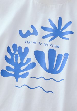 Cotton t-shirt with a white background featuring blue graphic designs of seaweed and waves, and the text "TAKE ME TO THE OCEAN."