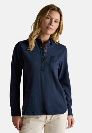 Navy long-sleeve polo shirt with a buttoned placket, collar, and chest pocket. Features contrasting buttons and a small embroidered logo.
