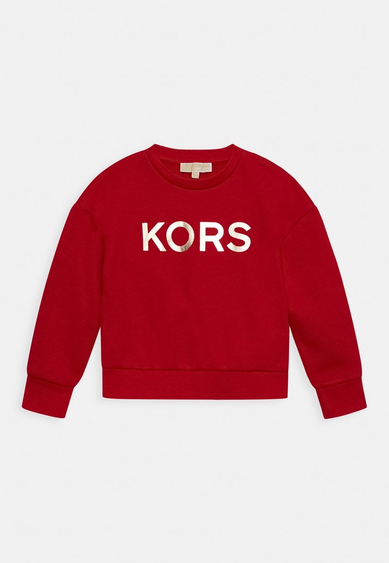 Sweat-shirt rouge à manches longues avec col rond, texte métallique « KORS » centré sur la poitrine, posé à plat sur un fond blanc.