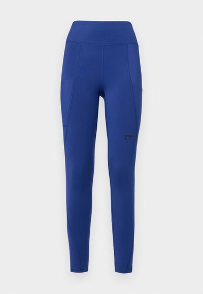 Navy blue active leggings with a high waistband, side pockets, and subtle branding. Made from stretchy, smooth fabric with a fitted shape.