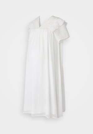 Fehér kismama hálóing pöttyös mintával, fodros rövid ujjal és V-nyakkivágással. Könnyű anyag a kényelemért a terhesség alatt.