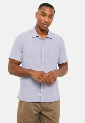 Short-sleeve, light blue linen shirt with a collar, front buttons, and a chest pocket. Features a subtle textured pattern.