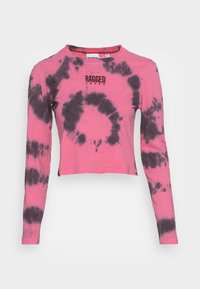 Long-sleeve, cropped T-shirt in pink with black tie-dye pattern. Features a round neckline and printed logo text on the front.