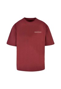 Burgundy cotton t-shirt with a loose fit, short sleeves, and a small white logo text on the upper left side. Smooth texture.