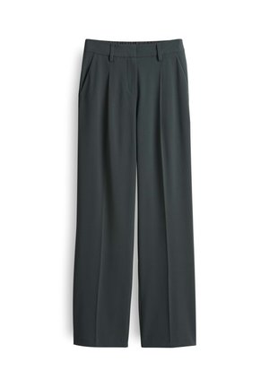 Donkergrijze wijde broek van soepel materiaal, met voorzakken en een op maat gemaakte tailleband met riemlussen.