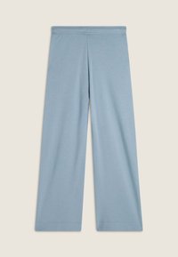 Helle blaue weite Hosen aus weichem Stoff. Mit einem elastischen Bund und sauberem, einfachem Nähen ohne Taschen oder Verzierungen.