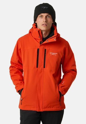Jasnopomarańczowa kurtka odporna na warunki atmosferyczne z zamkiem błyskawicznym z przodu, kapturem i dwiema czarnymi kieszeniami na zamek. Posiada regulowane mankiety i detal z logo.