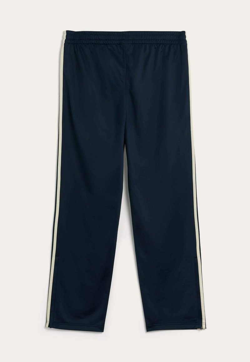 Navy athletic pants with an elastic waistband, featuring light gray side stripes, straight legs, and a smooth, lightweight fabric.