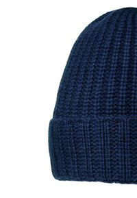 Navy blue knitted beanie hat with folded edge, textured ribbed and waffle knit pattern, isolated on white background.