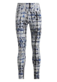 Medias con una base gris y un patrón abstracto en azul y negro, una cinturilla alta y una textura de tela suave y elástica.