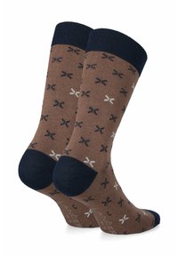 Brązowe skarpetki z powtarzającym się wzorem małych granatowych i białych kokardek, z ciemnoniebieskim prążkowanym mankietem i wzmocnionym palcem.
