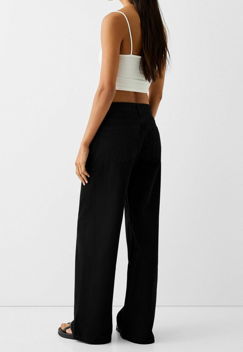 Bershka Jeans a zampa black/nero (Second hand)