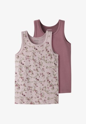 Deux tops sans manches pour enfants, un uni rose poussiéreux et un rose clair avec un petit motif floral vert et violet.