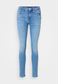 Vaaleansiniset skinny-farkut, jotka on valmistettu denimistä. Niissä on viisi taskua, nappisuljenta ja kangassa on mietoa kulutusta.