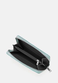 Zippered wallet with a light blue textured exterior, featuring a black interior with card slots and a central zipped compartment.