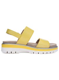Yellow leather sandal with two wide straps, a cushioned beige footbed, and a thick white and yellow treaded sole.