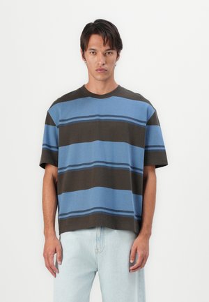 Striped t-shirt in blue and brown tones, featuring short sleeves, a relaxed fit, and a crew neckline. Minimalistic design with horizontal stripes.