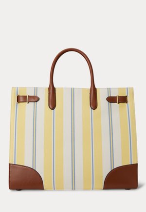 Kandekott vertikaalsete kollaste, valgete ja helesiniste triipudega, pruuni nahast käepidemete, nurkade aktsentide ning kuldsete pandla detailidega valgel taustal.