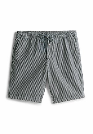 Gestreepte zwembroek met een zwart-wit verticaal streeppatroon, elastische tailleband met trekkoord en zijzakken.