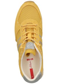 Yellow athletic shoe with mesh upper, silver accents, and textured sole. Features a cushioned insole labeled "Soft Foam" for comfort.