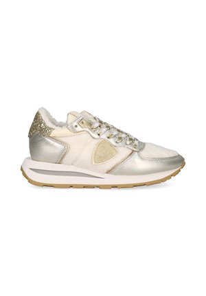 Sneaker with a white and metallic silver design, featuring fur lining, glittery accents on the heel, and a gum rubber outsole.