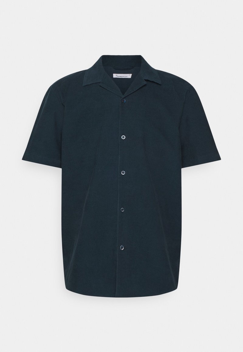 Kortärmad skjorta i mörk marinblå, tillverkad av textilier med struktur. Har en spetsig krage, knäppningar och en avslappnad passform.