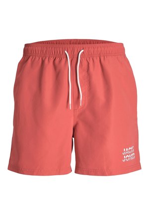 Shorts de bain en corail fabriqués en tissu léger. Ceinture élastique avec cordons blancs. Présente un logo blanc imprimé sur le devant.