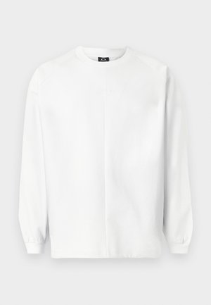 Hvid sweatshirt lavet af blødt stof, med rund hals, lange raglanærmer, ribstrikkede manchetter og et subtilt broderet logo på brystet.