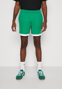 adidas Originals MOCK EYELET - Träningsbyxor - green