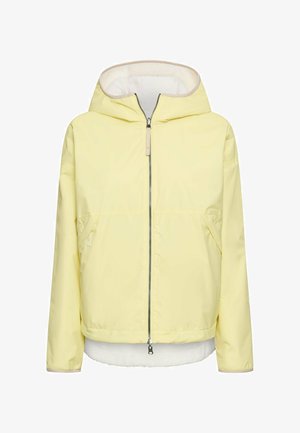 Lichtgele gewatteerde jas met capuchon, voorzien van een volledige ritssluiting aan de voorkant en zijzakken, met een witte fleece voering zichtbaar bij de zoom en aan de binnenkant van de capuchon.